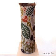 Wet-felted botanical-themed tall vessel.