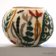 Wet-felted botanical-themed vessel.